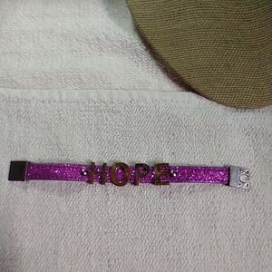 Purple goldtone hope glitter bracelet magnetic clasp